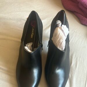 Calvin Klein Black Ankle Boots with Smooth Leather Finish and Elegant Silhouette